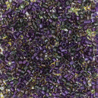 Close-up of small purple beads with a multicolor background