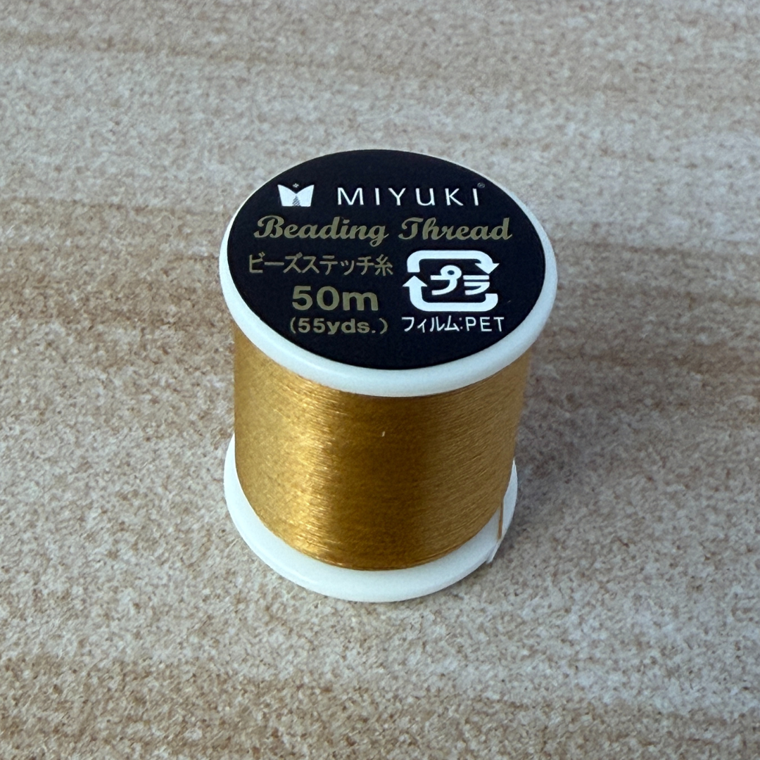 Close up of Miyuki Thread on a spool