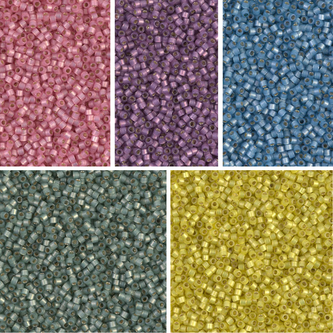 Close up of five colours of Miyuki beads.